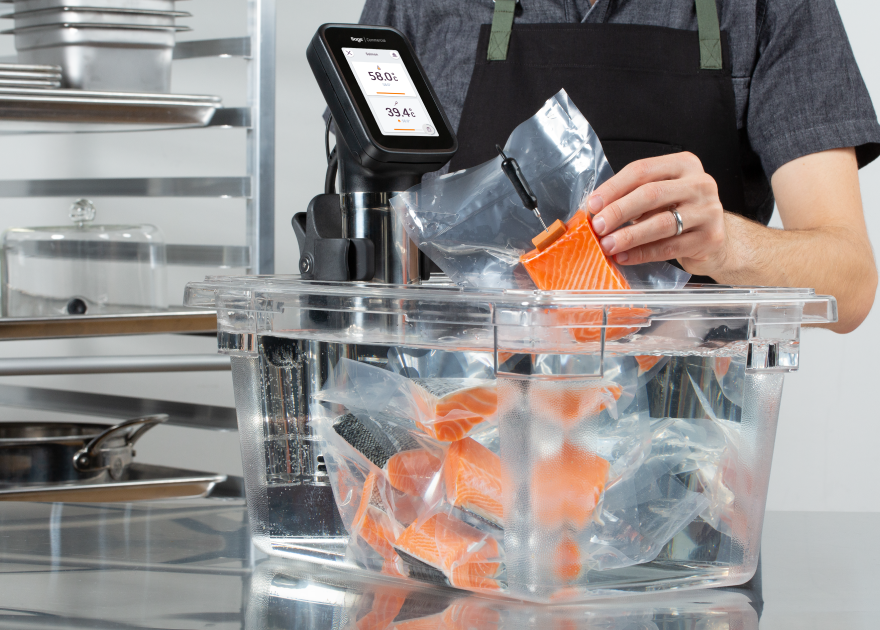 Vacuum-sealed food being dropped in a container